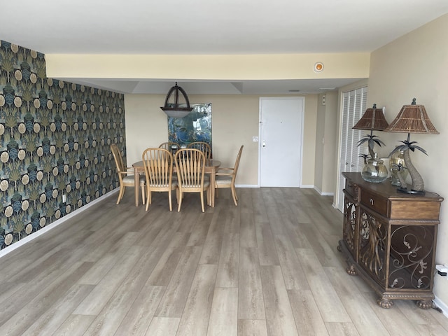 3589 S Ocean Blvd Unit 509, South Palm Beach, FL 33480 - dining space featuring wood finished floors and baseboards