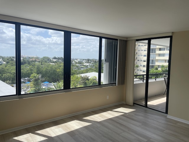 3589 S Ocean Blvd Unit 509, South Palm Beach, FL 33480 - spare room with wood finished floors and baseboards