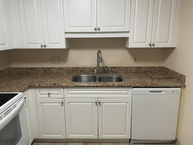 3589 S Ocean Blvd Unit 509, South Palm Beach, FL 33480 - kitchen featuring white appliances, a sink, white cabinetry, and dark stone countertops