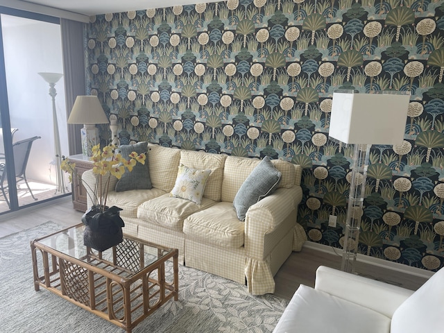 3589 S Ocean Blvd Unit 509, South Palm Beach, FL 33480 - living area featuring wood finished floors and healthy amount of natural light