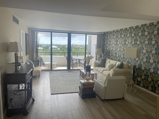 3589 S Ocean Blvd Unit 509, South Palm Beach, FL 33480 - living area featuring wood finished floors