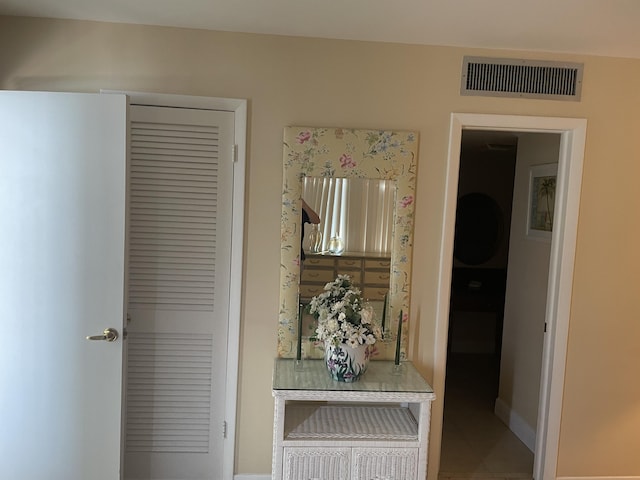 3589 S Ocean Blvd Unit 509, South Palm Beach, FL 33480 - corridor featuring tile patterned flooring and baseboards