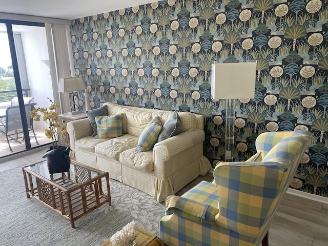 3589 S Ocean Blvd Unit 509, South Palm Beach, FL 33480 - living room featuring wood finished floors and floor to ceiling windows