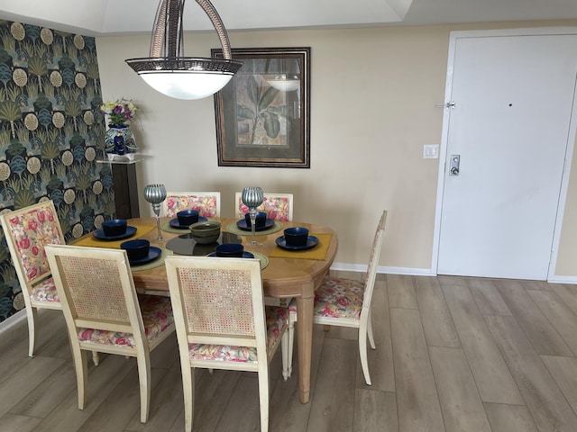 3589 S Ocean Blvd Unit 509, South Palm Beach, FL 33480 - dining area with wood finished floors and baseboards