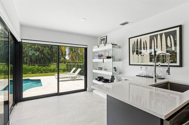 11020 Boca Woods Ln, Boca Raton, FL 33428 - kitchen with a sink and light stone countertops