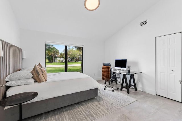11020 Boca Woods Ln, Boca Raton, FL 33428 - bedroom featuring lofted ceiling, concrete floors, a desk, and a closet