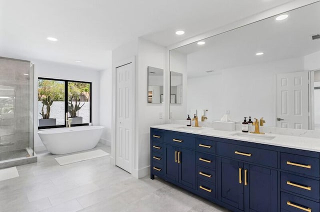 11020 Boca Woods Ln, Boca Raton, FL 33428 - bathroom with double vanity, a stall shower, recessed lighting, and a freestanding bath