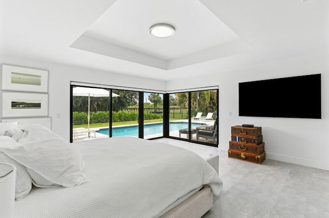 11020 Boca Woods Ln, Boca Raton, FL 33428 - bedroom featuring access to exterior, a raised ceiling, and baseboards