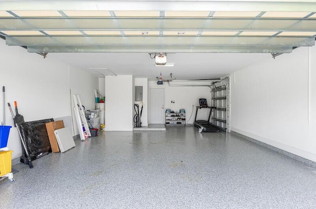 11020 Boca Woods Ln, Boca Raton, FL 33428 - garage with a garage door opener, electric panel, and baseboards