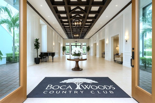 11020 Boca Woods Ln, Boca Raton, FL 33428 - building lobby featuring a decorative wall, coffered ceiling, beam ceiling, and crown molding