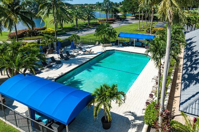 11020 Boca Woods Ln, Boca Raton, FL 33428 - community pool featuring a patio area and a water view