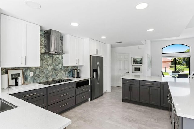 11020 Boca Woods Ln, Boca Raton, FL 33428 - kitchen featuring stainless steel appliances, wall chimney exhaust hood, light countertops, white cabinets, and recessed lighting