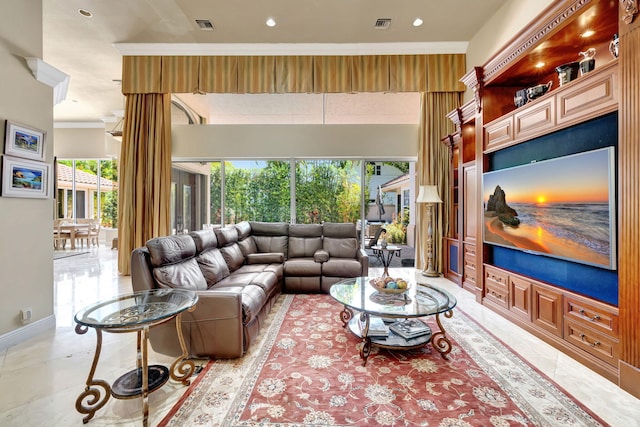 living room with crown molding, recessed lighting, and baseboards