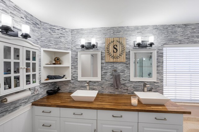 2266 SW Monterrey Ln, Port Saint Lucie, FL 34953 - full bathroom with double vanity and a shower