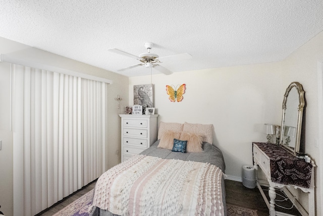 2266 SW Monterrey Ln, Port Saint Lucie, FL 34953 - bedroom with wood finished floors, a textured ceiling, and ceiling fan