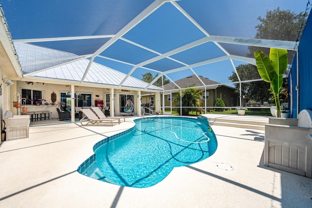 2266 SW Monterrey Ln, Port Saint Lucie, FL 34953 - outdoor pool featuring a patio area and glass enclosure