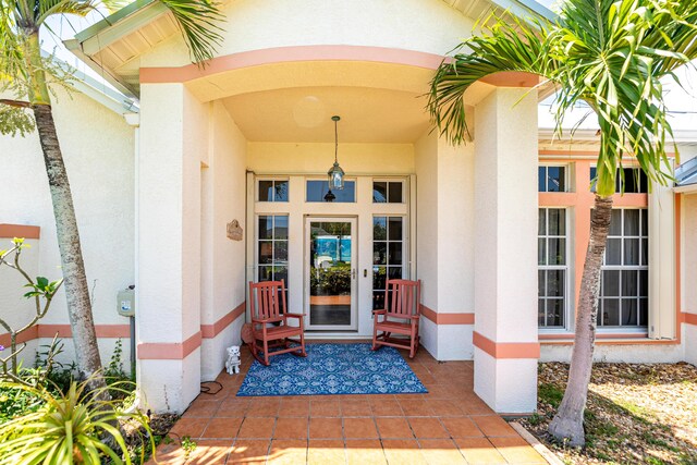 2266 SW Monterrey Ln, Port Saint Lucie, FL 34953 - doorway to property with stucco siding