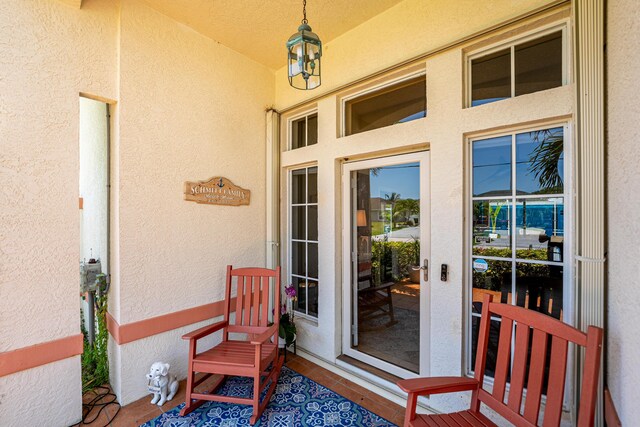 2266 SW Monterrey Ln, Port Saint Lucie, FL 34953 - property entrance with stucco siding