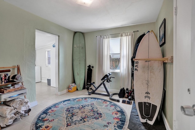 1008 SE 3rd St, Boynton Beach, FL 33435 - exercise room with baseboards and light tile patterned flooring
