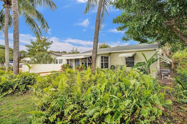 1008 SE 3rd St, Boynton Beach, FL 33435 - back of house with stucco siding and fence