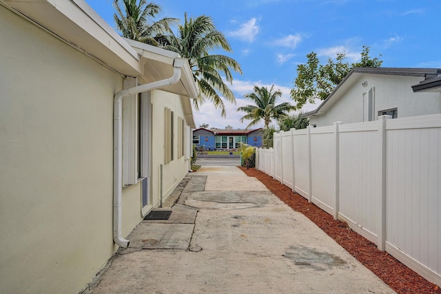 1008 SE 3rd St, Boynton Beach, FL 33435 - view of home's exterior featuring stucco siding, fence, and a patio