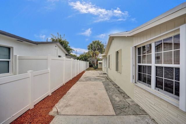 1008 SE 3rd St, Boynton Beach, FL 33435 - view of home's exterior with fence, stucco siding, and a patio