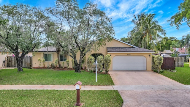 5340 SW 115th Ave, Cooper City, FL 33330 - view of front facade with stucco siding, an attached garage, and driveway
