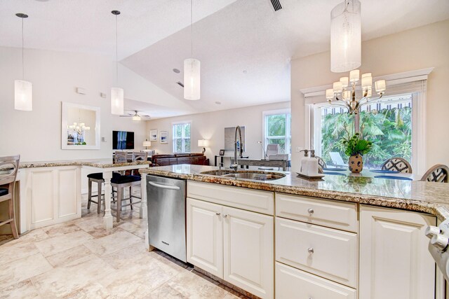 17586 Tiffany Trace Dr, Boca Raton, FL 33487 - kitchen featuring a sink, stainless steel dishwasher, a chandelier, vaulted ceiling, and light stone countertops