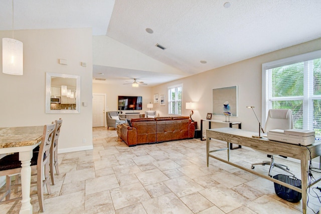 living area with vaulted ceiling, visible vents, baseboards, a textured ceiling, and ceiling fan