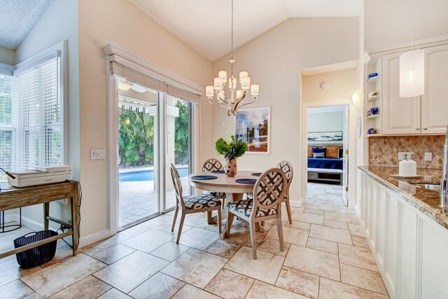 17586 Tiffany Trace Dr, Boca Raton, FL 33487 - dining area with lofted ceiling, a chandelier, and baseboards