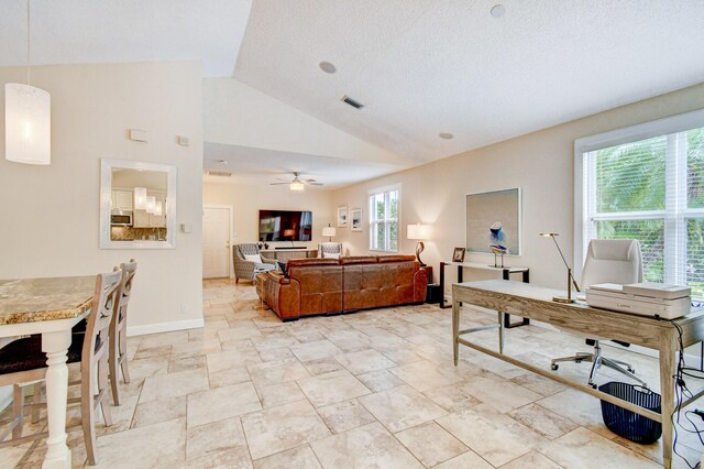 17586 Tiffany Trace Dr, Boca Raton, FL 33487 - living room featuring vaulted ceiling, a ceiling fan, baseboards, and a textured ceiling