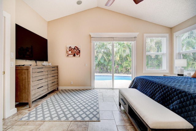 bedroom featuring lofted ceiling, baseboards, and access to outside