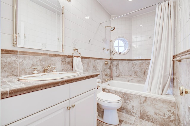 full bath featuring toilet, tile walls, vanity, and tiled shower / bath