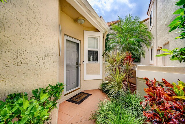 17586 Tiffany Trace Dr, Boca Raton, FL 33487 - view of exterior entry featuring stucco siding