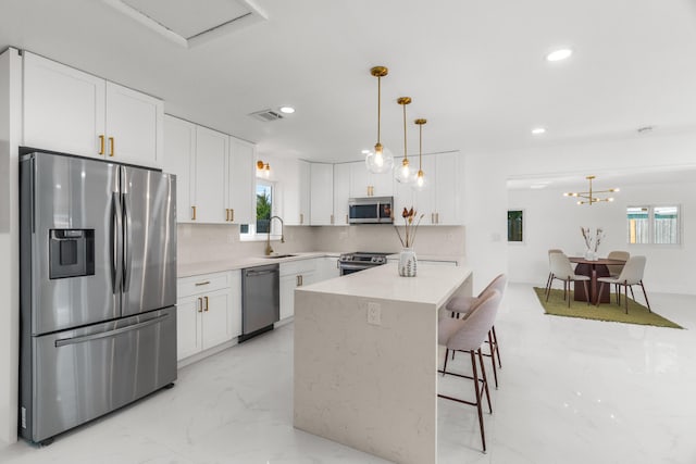 2771 NE 53rd St, Lighthouse Point, FL 33064 - kitchen featuring stainless steel appliances, a sink, visible vents, recessed lighting, and white cabinetry