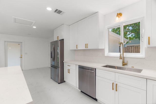 2771 NE 53rd St, Lighthouse Point, FL 33064 - kitchen featuring a sink, stainless steel appliances, light countertops, white cabinetry, and visible vents