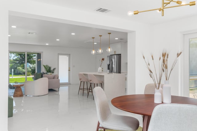 2771 NE 53rd St, Lighthouse Point, FL 33064 - dining space with recessed lighting, visible vents, marble finish floor, and an inviting chandelier
