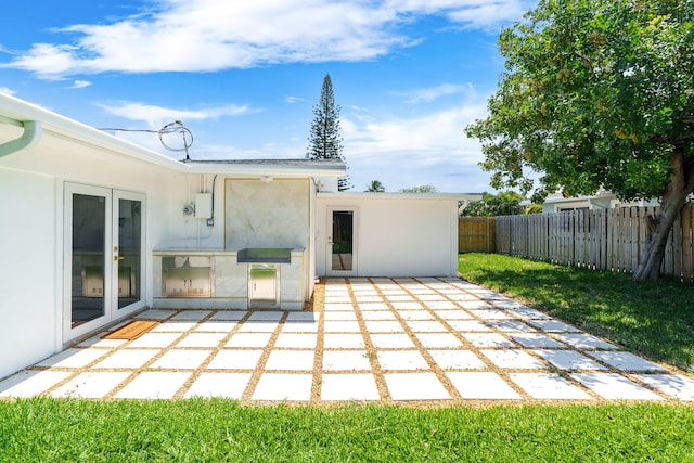2771 NE 53rd St, Lighthouse Point, FL 33064 - view of patio featuring french doors and fence