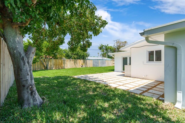 2771 NE 53rd St, Lighthouse Point, FL 33064 - view of yard with a patio area and a fenced backyard