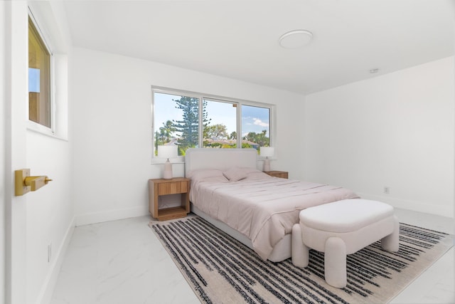 2771 NE 53rd St, Lighthouse Point, FL 33064 - bedroom featuring baseboards and marble finish floor