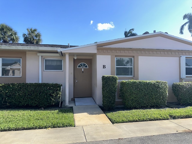 2511 W Dudley Dr Unit B, West Palm Beach, FL 33415 - view of front facade featuring stucco siding