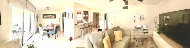interior space with lofted ceiling and a ceiling fan