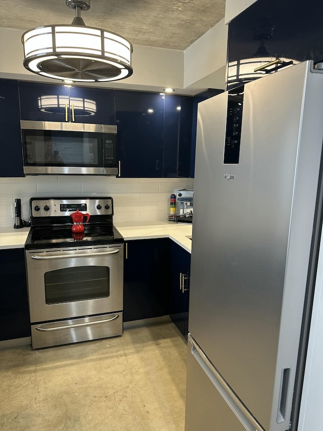 3570 S Ocean Blvd Unit 205, South Palm Beach, FL 33480 - kitchen featuring concrete flooring, dark cabinetry, decorative backsplash, and stainless steel appliances