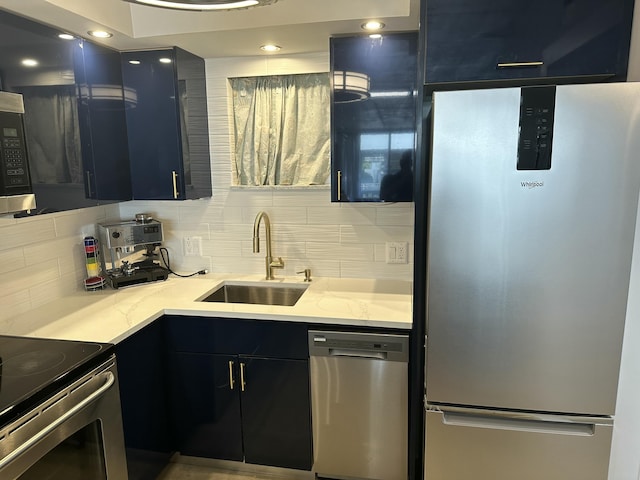 3570 S Ocean Blvd Unit 205, South Palm Beach, FL 33480 - kitchen with stainless steel appliances, a sink, tasteful backsplash, light stone counters, and dark cabinets