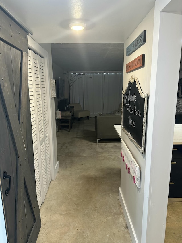 3570 S Ocean Blvd Unit 205, South Palm Beach, FL 33480 - corridor with concrete floors