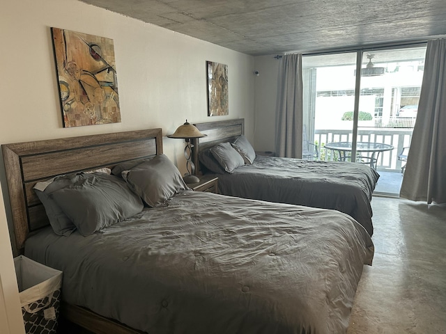 3570 S Ocean Blvd Unit 205, South Palm Beach, FL 33480 - bedroom featuring concrete flooring and access to outside