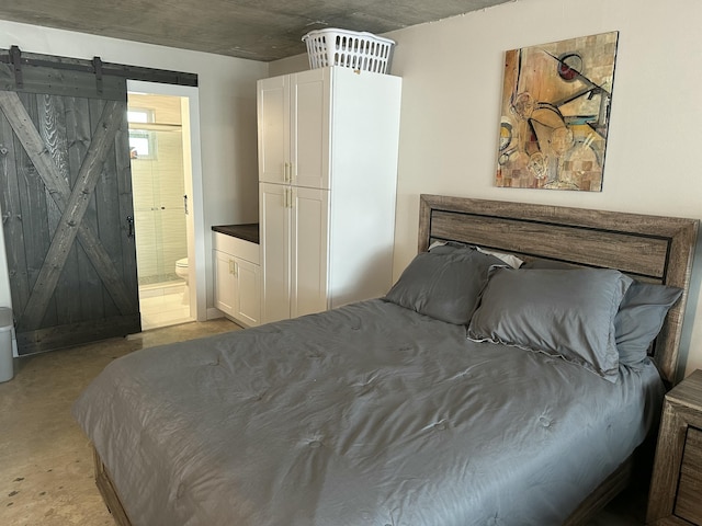 3570 S Ocean Blvd Unit 205, South Palm Beach, FL 33480 - bedroom featuring a barn door and ensuite bathroom
