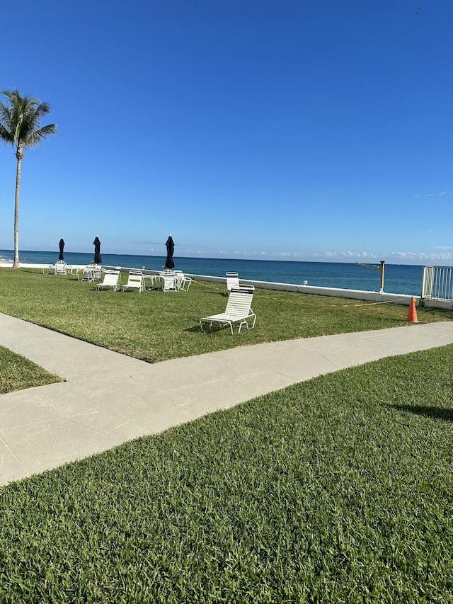 3570 S Ocean Blvd Unit 205, South Palm Beach, FL 33480 - surrounding community with a water view and a yard