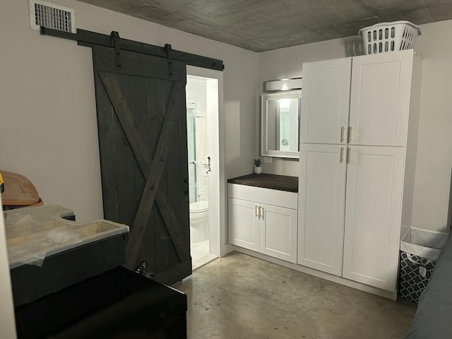 3570 S Ocean Blvd Unit 205, South Palm Beach, FL 33480 - bathroom featuring visible vents, concrete floors, vanity, and toilet