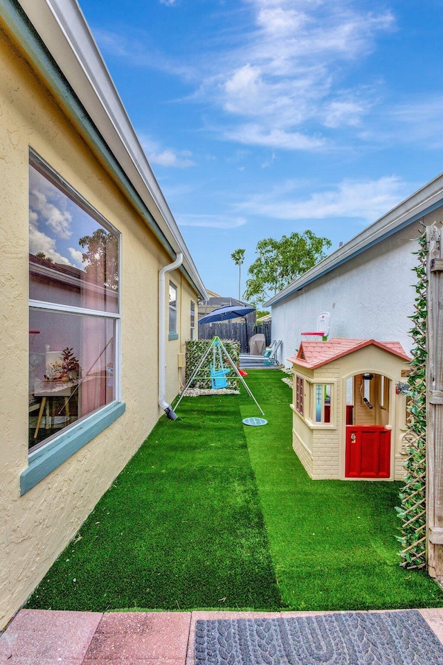 1275 Waterway Cove Dr, Wellington, FL 33414 - view of yard featuring an outdoor structure and fence